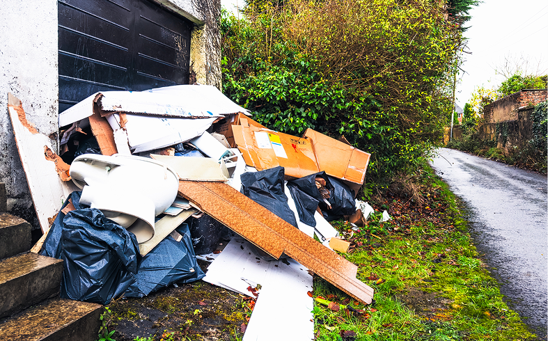 Piled debris beside a road