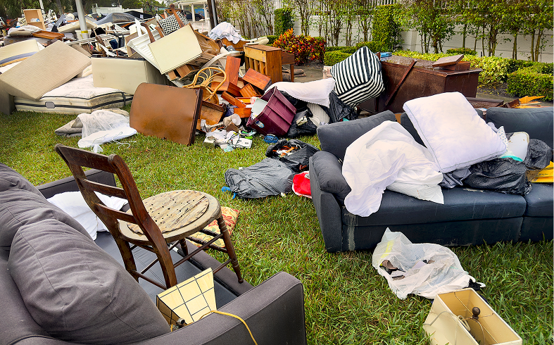 Messy heap of furniture and trash outside